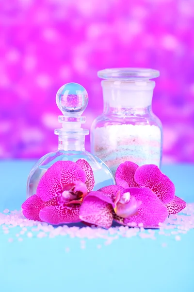 Beautiful spa setting with orchid on purple background — Stock Photo, Image