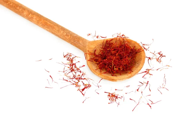 Stigmas of saffron in wooden spoon on white background close-up — Stock Photo, Image