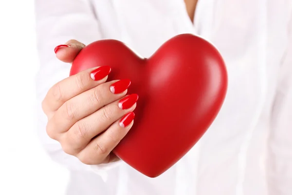 Red heart in woman's hand isolated on white — Stock Photo, Image