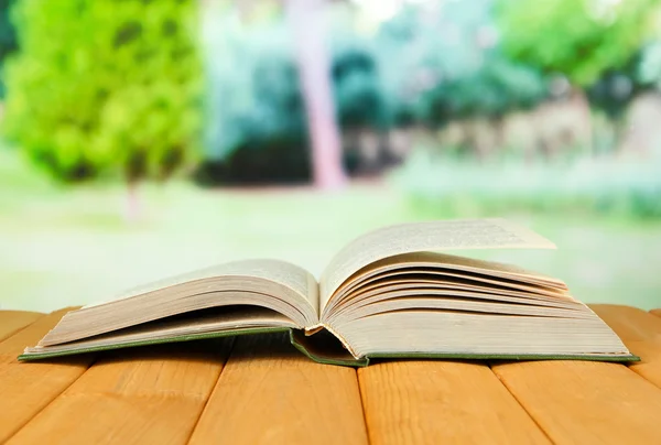 Opened book on bright background — Stock Photo, Image