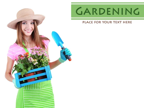 Jardineiro menina bonita com flores isoladas em branco — Fotografia de Stock