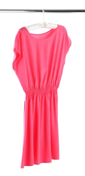 Schönes rosa Kleid hängt an Kleiderbügeln isoliert auf weiß — Stockfoto