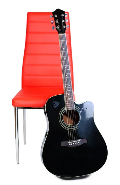 Acoustic guitar near chair, isolated on white — Stock Photo, Image