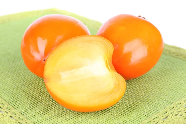 Ripe persimmons on table on white background — Stock Photo, Image