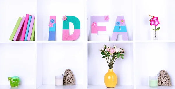 White shelves decorated with handmade knit word — Stock Photo, Image