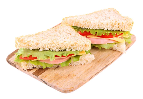 Fresh and tasty sandwiches on cutting board isolated on white — Stock Photo, Image