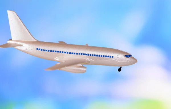 Avião de plástico em fundo azul — Fotografia de Stock