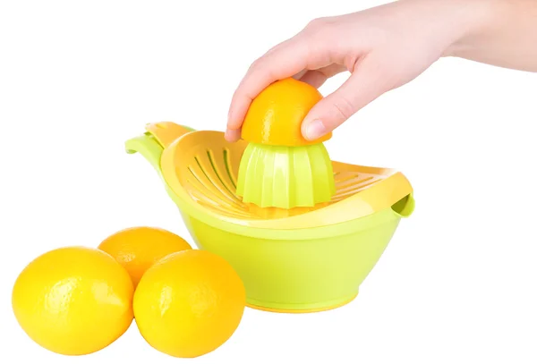 Preparing fresh lemon juice squeezed with hand juicer isolated on white — Stock Photo, Image