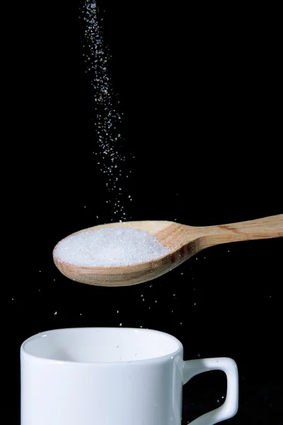 Sugar isolated on black — Stock Photo, Image