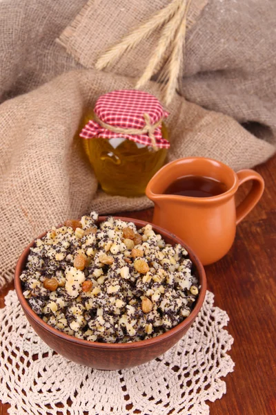 Bowl with kutia - traditional Christmas sweet meal in Ukraine, Belarus and Poland, on wooden background — Stock Photo, Image