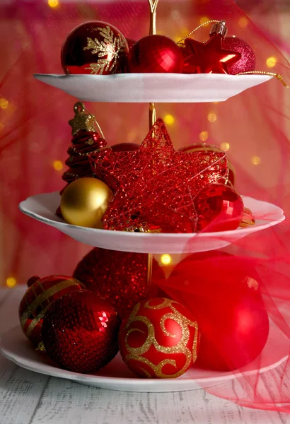 Christmas decorations on dessert stand, on color background — Stock Photo, Image