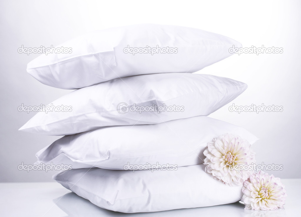 pillows and flowers, on grey background