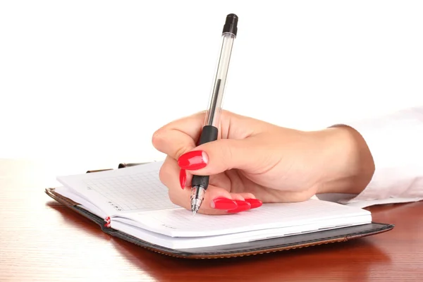 Firma a mano en cuaderno sobre mesa de madera aislada sobre blanco —  Fotos de Stock