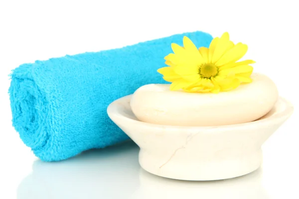 Rolled blue towel, soap bar and beautiful flower isolated on white — Stock Photo, Image