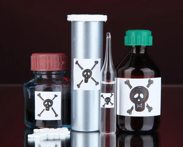 Deadly poison in bottles on black background — Stock Photo, Image