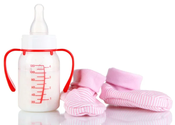 Bottle for milk formula with booties isolated on white — Stock Photo, Image