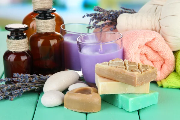 Still life with lavender candle, soap, massage balls, soap and fresh lavender, on bright background — Stock Photo, Image