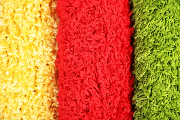 Many carpets of different colors close-up — Stock Photo, Image