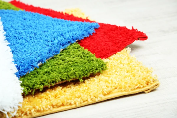 Many carpets of different colors close-up — Stock Photo, Image