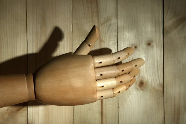 Wooden hand on wooden background — Stock Photo, Image