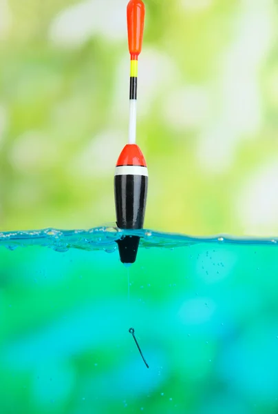 Fishing float in water on natural background — Stock Photo, Image