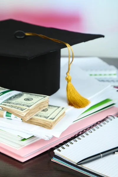 Money for graduation or training on wooden table close-up — Stock Photo, Image