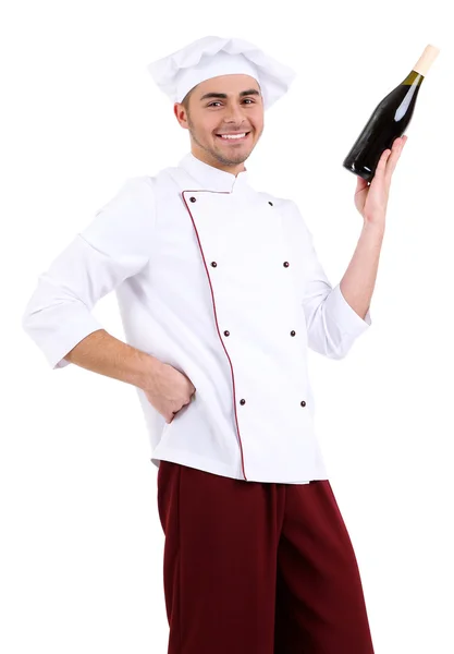 Chef profissional em uniforme branco e chapéu, segurando garrafa de vinho, isolado em branco — Fotografia de Stock