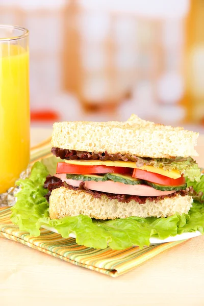 Fresh and tasty sandwich on plate on table on light background — Stock Photo, Image