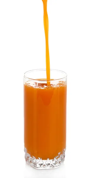 Juice pouring into glass isolated on white — Stock Photo, Image