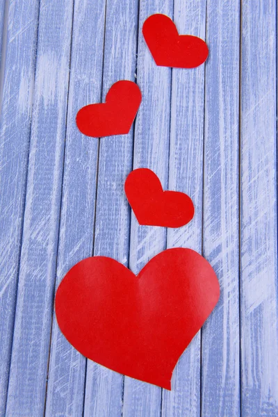 Paper hearts on wooden background — Stock Photo, Image