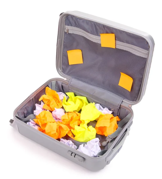 Open suitcase with paper stickers isolated on white — Stock Photo, Image