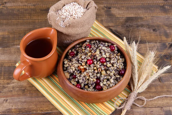 Bowl with kutia - traditional Christmas sweet meal in Ukraine, Belarus and Poland, on wooden background — Stock Photo, Image