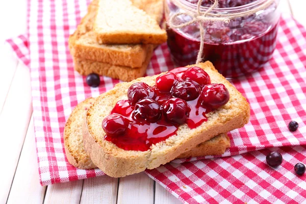 Delicious toast with jam on table close-up — Stock Photo, Image