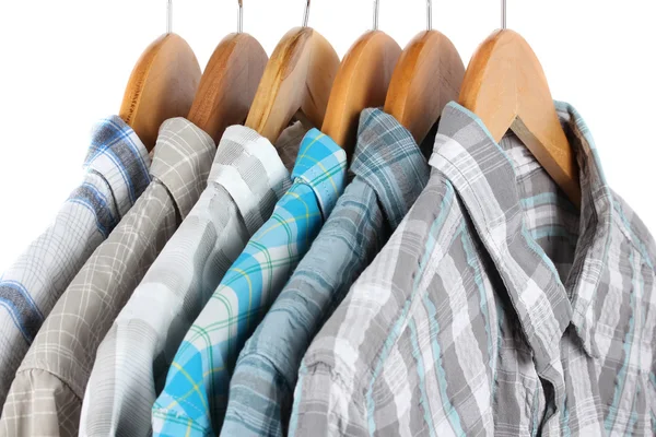 Shirts with ties on wooden hangers isolated on white — Stock Photo, Image