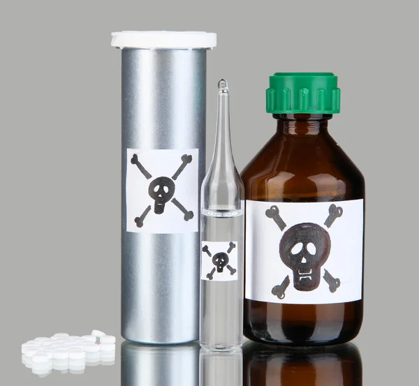 Deadly poison in bottles on grey background — Stock Photo, Image