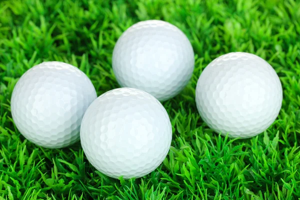 Golf balls on grass close up — Stock Photo, Image