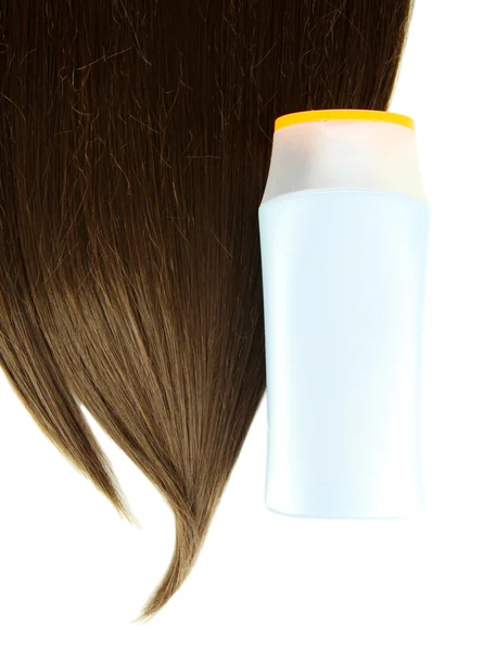 Шинные коричневые волосы с шампунем, изолированным на белом — стоковое фото