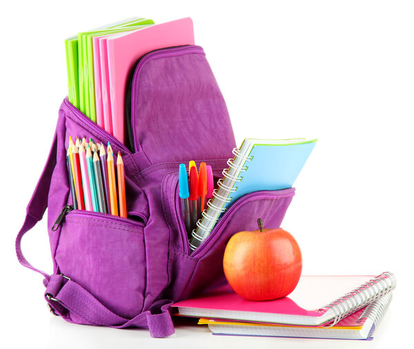 Purple backpack with school supplies isolated on white