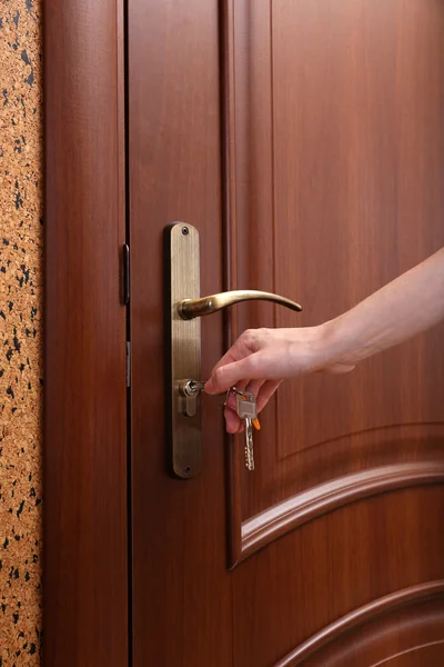 Locking up or unlocking door with key in hand — Stock Photo, Image