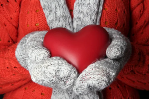 Female hands in mittens with heart, close-up — Stock Photo, Image