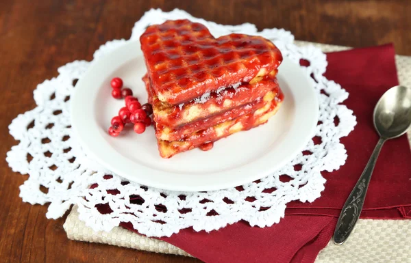 Sweet Belgium waffles with jam, on wooden table background — Stock Photo, Image