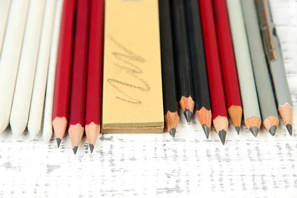 Professional art materials, on wooden table — Stock Photo, Image