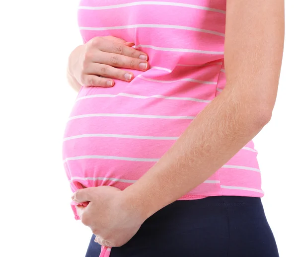 Mujer embarazada tocando su vientre aislado en blanco — Foto de Stock