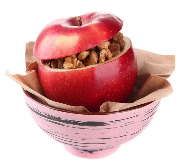 Apple met rozijnen en noten in kom geïsoleerd op wit — Stockfoto