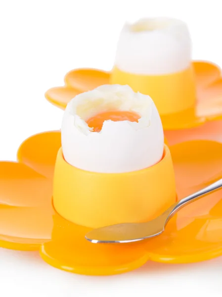 Boiled eggs in egg cups isolated on white — Stock Photo, Image