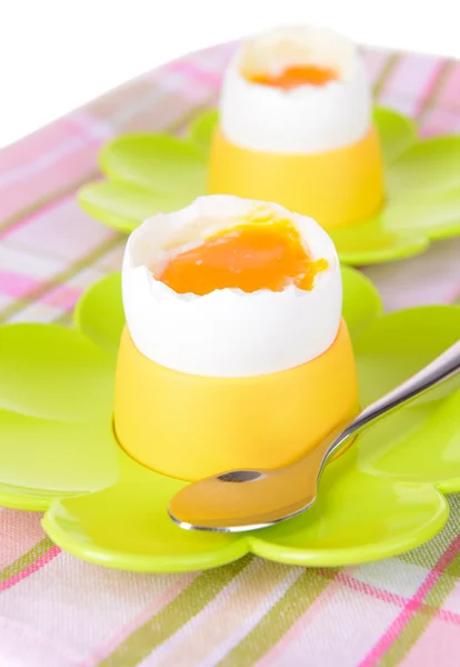 Boiled eggs in egg cups on table close-up — Stock Photo, Image