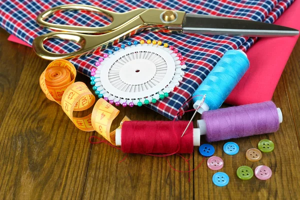 Sewing accessories on wooden table — Stock Photo, Image