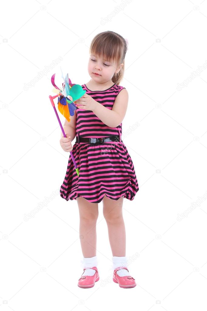 Beautiful little girl holding colorful windmill isolated on white
