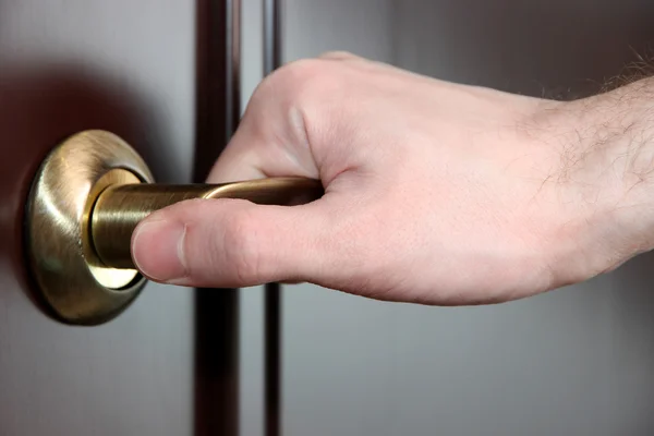 Someone opens door close-up — Stock Photo, Image