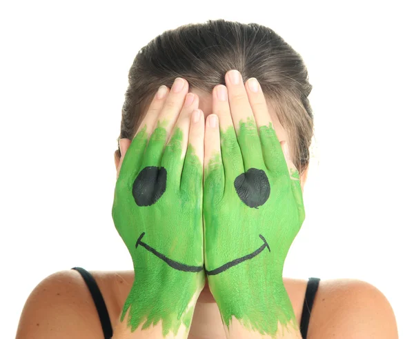 Portrait of girl hiding her face under smile mask isolated on white — Stock Photo, Image